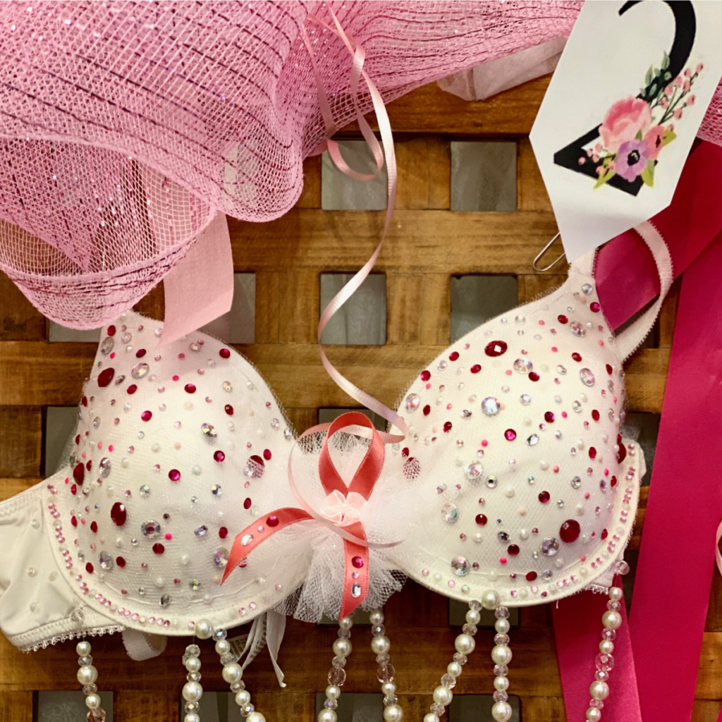 Women make a statement against breast cancer with artful bras at